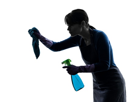 one caucasian woman maid cleaning  in silhouette studio isolated on white backgroundの写真素材