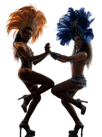 two women samba dancer  dancing silhouette  on white backgroundの写真素材