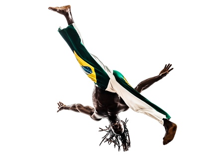 one brazilian  black man dancer dancing capoiera on white backgroundの写真素材