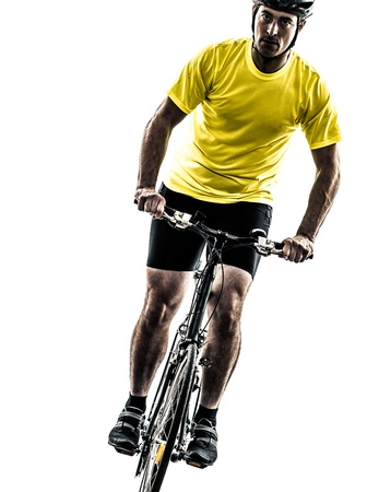 one caucasian man exercising bicycle mountain bike   on white backgroundの写真素材