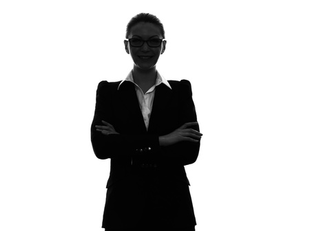 one caucasian business woman  arms crossed portrait in silhouette  on white backgroundの写真素材