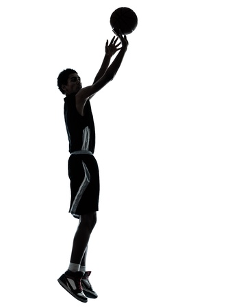 one young man basketball player silhouette in studio isolated on white backgroundの写真素材
