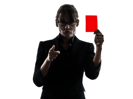 one business woman showing red card  silhouette studio isolated on white backgroundの写真素材
