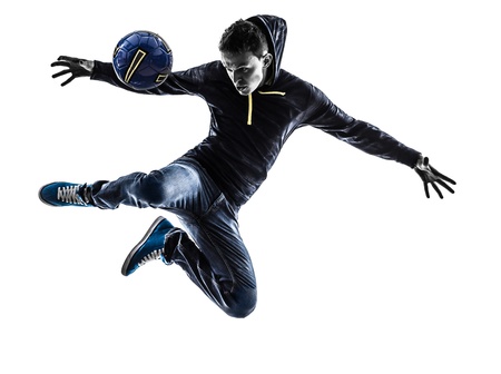 one caucasian young man soccer freestyler player in silhouette on white background one caucasian young man soccer freestyler player in silhouette on white background
