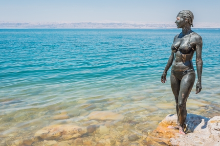 one caucasian woman with dead sea mud body care treatment in jordanの写真素材