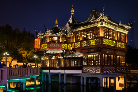 Shanghai, China - April 7, 2013: ancient tea house Fang Bang Zhong Lu old city at night in the city...