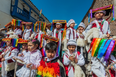 Cuzco, Peru - July 12, 2013: kids in traditional costumes in the Plaza de Armas at Cuzco Peru on...