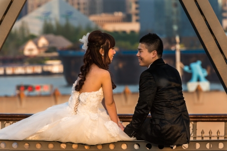Shanghai, China - April 7, 2013:  young wedding couple on The Waibaidu Bridge at the city of Shanghai in China on april 7th, 2013のeditorial素材