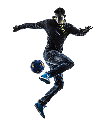 one caucasian young man soccer freestyler player in silhouette on white background one caucasian young man soccer freestyler player in silhouette on white background