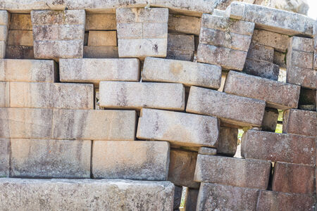 erosion in a main temple wall at Machu Picchu, Incas ruins in the peruvian Andes at Cuzco Peruの写真素材