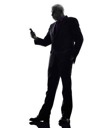One Caucasian Senior Business Man on the telephone angry Silhouette White Backgroundの写真素材