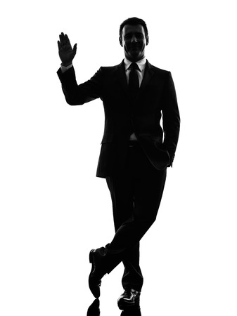one caucasian business man saluting  in silhouette  on white backgroundの写真素材