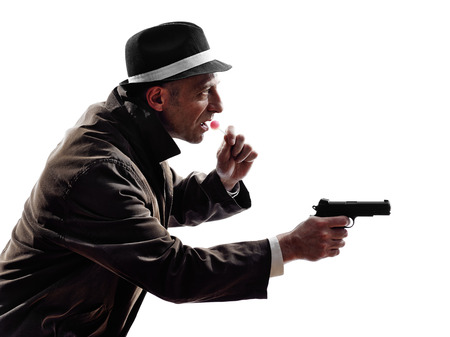 one detective man criminal investigations  investigating crime in silhouette on white backgroundの写真素材