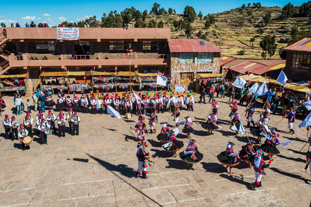 Puno, Peru - July 25, 2013: musicians and dancers in the peruvian Andes at Taquile Island on Puno Peru at july 25th, 2013.のeditorial素材