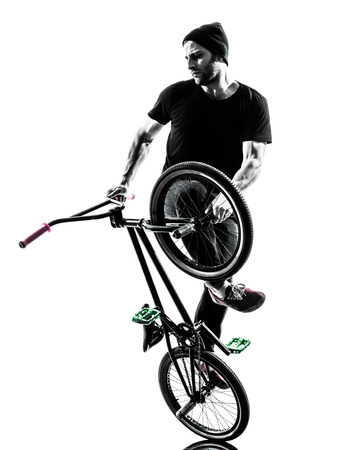 one man exercising bmx acrobatic figure in silhouette studio isolated on white background one man exercising bmx acrobatic figure in silhouette studio isolated on white background