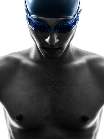 one young man swimmer swimming in silhouette on white backgroundの写真素材