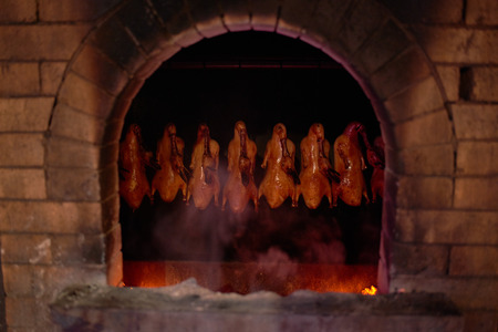 traditional Chinese Roast Duck cooking at tha famous Dadong restaurant Beijing Chinaの写真素材