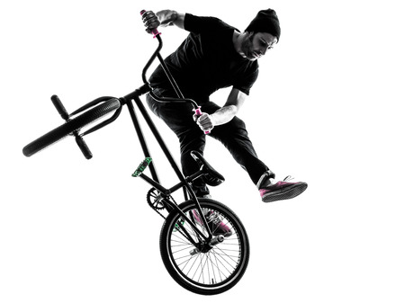 one man exercising bmx acrobatic figure in silhouette studio isolated on white background one man exercising bmx acrobatic figure in silhouette studio isolated on white background