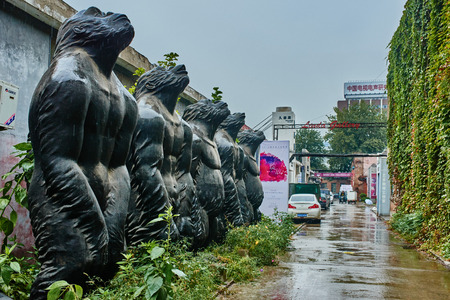 Beijing , China - September 23, 2014 :  statues sculptures in the streets of the 798 Art District zone aera in Beijing Chinaのeditorial素材
