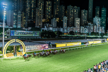 Happy Valley, Hong Kong, China- June 5, 2014: horse race at Happy Valley racecourseのeditorial素材