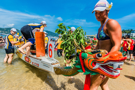 Hong Kong, China- June 2 , 2014: People racing the Dragon boats festival race in Stanley beachのeditorial素材
