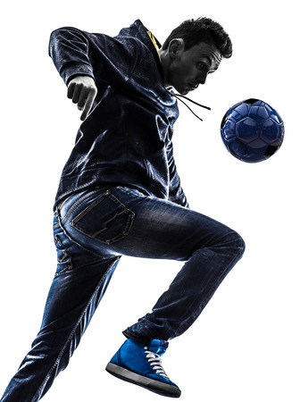 one young man soccer freestyler player in silhouette on white background one young man soccer freestyler player in silhouette on white background