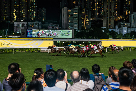 Happy Valley, Hong Kong, China- June 5, 2014: spectators watching horse races at Happy Valley racecourseのeditorial素材