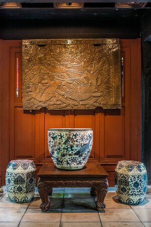 Bangkok, Thailand - December 28, 2013: wooden carving and ceramics vases at Jim Thompson House museum Bangkok Thailandのeditorial素材