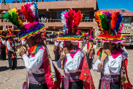 Puno, Peru - July 25, 2013: musicians and dancers in the peruvian Andes at Taquile Island on Puno...