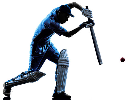 Cricket player batsman in silhouette shadow on white backgroundの写真素材