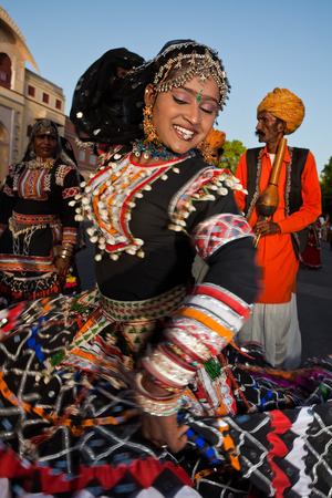 Jaipur, India - March 30, 2009 : women dancing in traditional costume  are celebrating the gangaur festival  in jaipur rajasthan indiaのeditorial素材