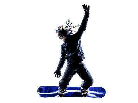 one  young snowboarder man in silhouette white backgroundの写真素材