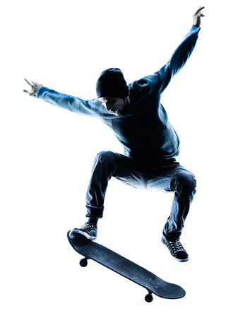 one caucasian man skateboarder skateboarding  in silhouette isolated on white backgroundの写真素材