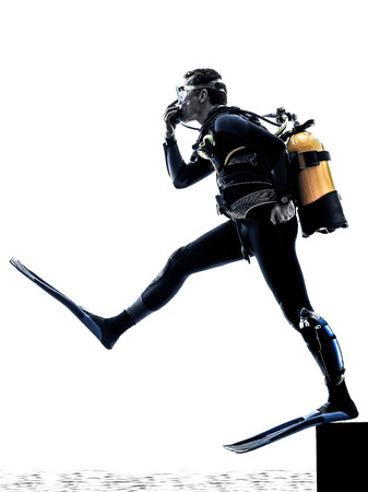 one caucasian scuba diver diving man  in studio  silhouette isolated on white backgroundの写真素材