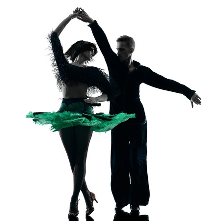 caucasian elegant couple dancers dancing in studio silhouette isolated on white backgroundの写真素材