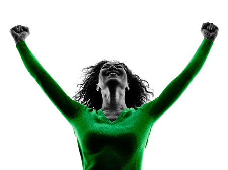 one mixed race young woman happiness arms raised silhouette isolated on white backgroundの写真素材