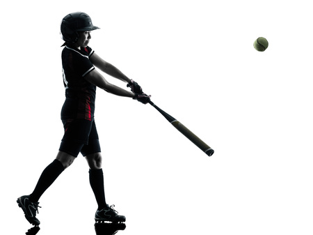 one woman playing softball players in silhouette isolated on white backgroundの写真素材