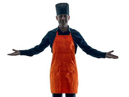 one caucasian man cooking chef silhouette isolated on white backgroundの写真素材