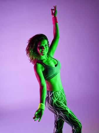 one caucasian woman dancer dancing fitness exercises isolated on colorful backgroundの写真素材