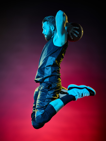 one basketball player man Isolated on black backgroundの写真素材
