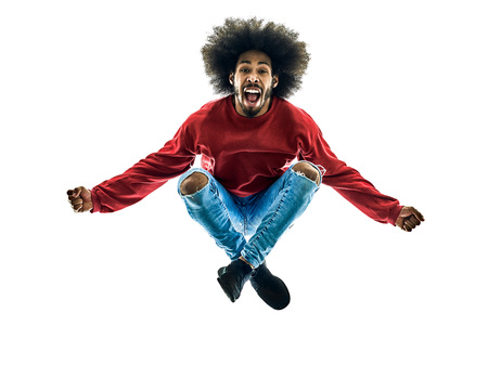 one african man jumping happy in silhouette isolated on white backgroundの写真素材