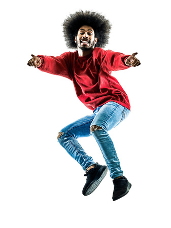 one african man jumping pointing in silhouette isolated on white background