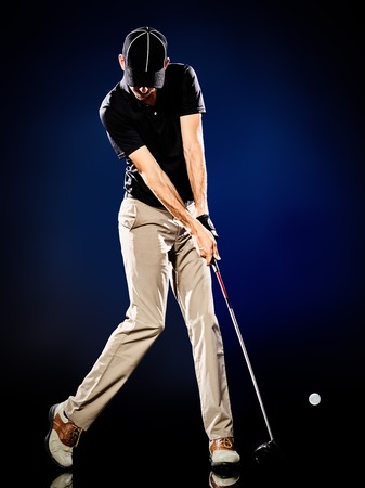 one caucasian  man golfer golfing isolatedの写真素材