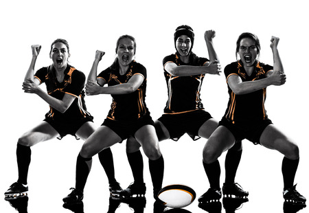 rugby women players team celebration in silhouette isolated on white backroundの写真素材