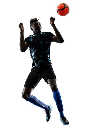 one african soccer player man playing in studio isolated on white backgroundの写真素材