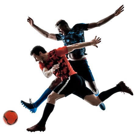 two soccer players men in studio silhouette isolated on white backgroundの写真素材