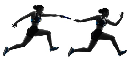 athletics relay runners sprinters running runners in silhouette isolated on white backgroundの写真素材