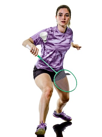 one caucasian young teenager girl woman playing Badminton player isolated on white backgroundの写真素材
