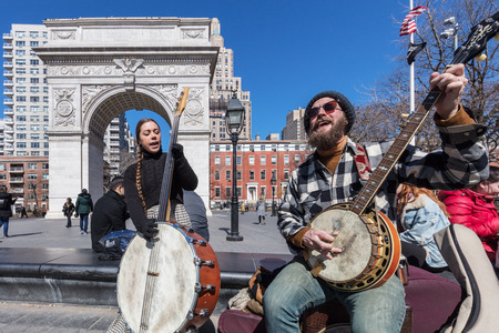 NEW YORK CITY- MARCH 26, 2018 : Musicians palying in front of Washington Square one of the main Manhattan Landmarksのeditorial素材