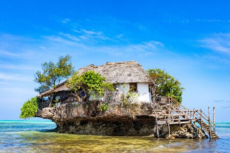 Pingwe , Zanzibar-March 7, 2019 : the Rock famous amazing location restaurant on the beachのeditorial素材